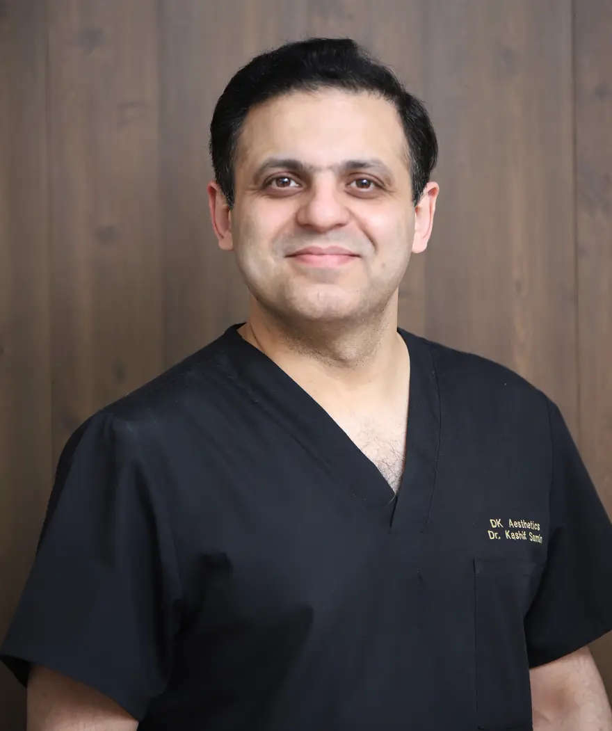 Dr. Kashif Ali in clinic scrubs